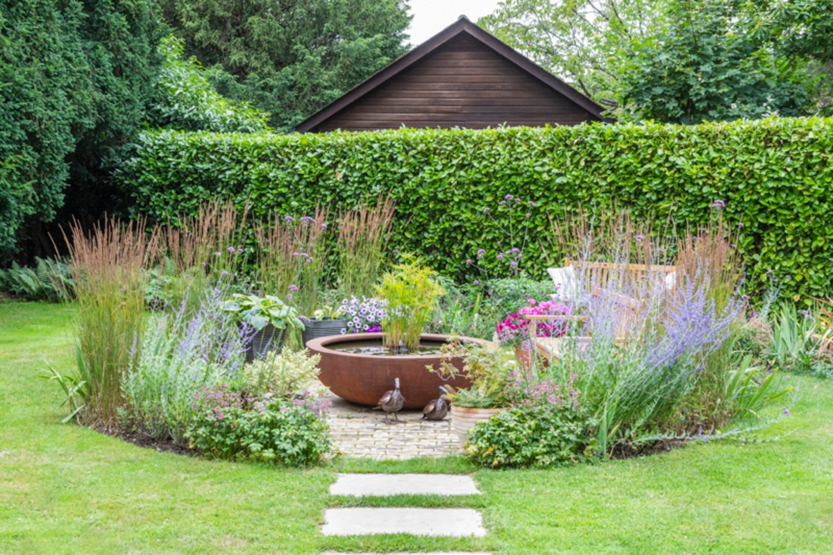 Contemporary View, Chelmsford Essex. Design and Build Cube 1994 Ltd. Urbis Bowl, woodland planting, stepping stone path